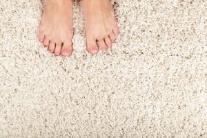 feet on soft cream carpet